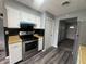 A kitchen features stainless steel oven, white cabinets, and wooden countertops at 3055 Pawnee Dr, Indianapolis, IN 46235