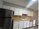 The kitchen featuring stainless steel appliances and ample counter space at 3055 Pawnee Dr, Indianapolis, IN 46235
