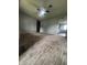 Spacious living room featuring neutral paint, carpet, and a ceiling fan at 3055 Pawnee Dr, Indianapolis, IN 46235