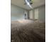 Spacious living room features plush carpet and neutral paint at 3055 Pawnee Dr, Indianapolis, IN 46235