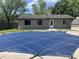 Backyard pool covered with a safety cover at 3055 Pawnee Dr, Indianapolis, IN 46235
