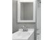 Bright bathroom featuring a modern sink, framed mirror, and updated shower head at 3072 Falcon Dr, Indianapolis, IN 46222
