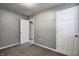 Cozy bedroom features soft carpet, fresh paint, and white trim at 3072 Falcon Dr, Indianapolis, IN 46222