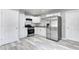 Modern kitchen with stainless steel appliances and ample cabinet space at 3072 Falcon Dr, Indianapolis, IN 46222