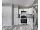 Well-lit kitchen with stainless steel appliances and granite countertops at 3072 Falcon Dr, Indianapolis, IN 46222