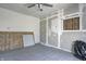 Unfinished space features gray vinyl flooring and a partially boarded up window at 3072 Falcon Dr, Indianapolis, IN 46222