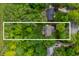 Aerial view of property showcasing a large, treed lot and surrounding neighborhood at 3230 Amherst St, Indianapolis, IN 46268