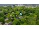 Aerial view of a charming home nestled amongst lush trees and greenery, offering privacy and natural beauty at 3230 Amherst St, Indianapolis, IN 46268