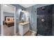 Bathroom with a marble countertop, glass shower, and views into the main bedroom at 3230 Amherst St, Indianapolis, IN 46268