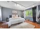 Cozy bedroom with hardwood floors, a large window, and ample natural light at 3230 Amherst St, Indianapolis, IN 46268