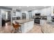 Bright kitchen with white cabinets, granite countertops, stainless steel appliances, and a center island at 3230 Amherst St, Indianapolis, IN 46268