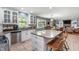 Modern kitchen featuring granite countertops, stainless steel appliances, and an island with seating at 3230 Amherst St, Indianapolis, IN 46268