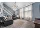 Cozy living room featuring vaulted ceilings, a ceiling fan, and plush carpet at 3230 Amherst St, Indianapolis, IN 46268