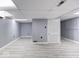 Finished basement offers a versatile space with wood floors, a drop ceiling, and separate doors at 3342 Foltz St, Indianapolis, IN 46221