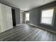 Bedroom with built-in closet, and hardwood floors at 3342 Foltz St, Indianapolis, IN 46221
