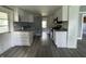 Kitchen features white cabinets, gray countertops, and stainless steel appliances at 3342 Foltz St, Indianapolis, IN 46221