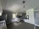 Kitchen features white cabinets, a gray countertop, and stainless steel appliances at 3342 Foltz St, Indianapolis, IN 46221