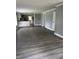 Spacious living room with gray walls and modern floors leading to the kitchen at 3342 Foltz St, Indianapolis, IN 46221