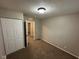 Cozy bedroom featuring plush carpeting, ample closet space, and neutral wall colors at 3628 Breen Dr, Indianapolis, IN 46235