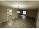 Dining area with modern floors, decorative lighting, and views into the kitchen space at 3628 Breen Dr, Indianapolis, IN 46235