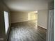 Spacious living room featuring modern flooring, ample natural light, and neutral paint at 3628 Breen Dr, Indianapolis, IN 46235