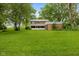 Large backyard with green grass, showcasing the property's spaciousness and potential at 502 S Harrison St, Alexandria, IN 46001