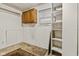 Basement featuring a window and some shelving at 502 S Harrison St, Alexandria, IN 46001