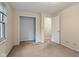 Neutral-toned bedroom includes a closet and an open door to another room at 502 S Harrison St, Alexandria, IN 46001