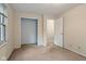 Neutral-toned bedroom includes a closet and an open door to another room at 502 S Harrison St, Alexandria, IN 46001