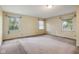 Spacious bedroom with three windows, providing ample natural light and views of the outdoors at 502 S Harrison St, Alexandria, IN 46001
