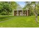 Charming brick home featuring a spacious lawn and classic architectural details at 502 S Harrison St, Alexandria, IN 46001
