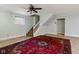 Spacious living room with an oriental rug and staircase leading to the second floor at 502 S Harrison St, Alexandria, IN 46001