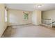 Spacious living room featuring a window and staircase, ideal for comfortable living at 502 S Harrison St, Alexandria, IN 46001