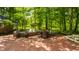 Expansive brick patio with multiple seating areas, hot tub, and lush greenery, perfect for outdoor entertaining at 535 W 93Rd St, Indianapolis, IN 46260