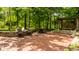 Spacious brick patio with dining and lounge seating, hot tub, and lush greenery for a tranquil outdoor experience at 535 W 93Rd St, Indianapolis, IN 46260