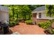 Beautiful brick patio backyard with a grill, landscaping, and an outdoor dining area for entertaining guests at 535 W 93Rd St, Indianapolis, IN 46260