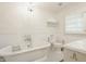Charming bathroom featuring a clawfoot tub, chandelier, and classic fixtures at 535 W 93Rd St, Indianapolis, IN 46260