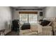 Comfortable bedroom with desk, window views, and neutral color palette at 535 W 93Rd St, Indianapolis, IN 46260