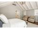 Serene bedroom featuring vaulted ceilings, large windows, and comfortable chairs at 535 W 93Rd St, Indianapolis, IN 46260