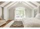 Inviting bedroom with vaulted ceilings, natural light, and cozy seating area at 535 W 93Rd St, Indianapolis, IN 46260