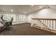 Spacious bonus room with ample windows, desk area, and access to stairs, perfect for a home office or recreational space at 535 W 93Rd St, Indianapolis, IN 46260