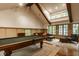 Spacious game room with a pool table, comfortable seating, and natural light at 535 W 93Rd St, Indianapolis, IN 46260