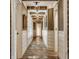 Attractive hallway featuring brick-laid floors, exposed beams, and custom wainscoting at 535 W 93Rd St, Indianapolis, IN 46260