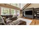 Stylish living room with hardwood floors, large windows, and a custom entertainment center, perfect for relaxing and entertaining at 535 W 93Rd St, Indianapolis, IN 46260