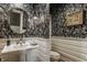 Chic powder room with patterned wallpaper, pedestal sink, and elegant lighting at 535 W 93Rd St, Indianapolis, IN 46260