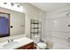 Bright bathroom features a vanity with sink and a shower-tub combo at 539 Deer Trail Dr, Indianapolis, IN 46217