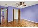 Spacious bedroom with wood floors, ceiling fan, closet and adjacent rooms for flexible living at 539 Deer Trail Dr, Indianapolis, IN 46217