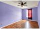 Bedroom with wood floors, ceiling fan and bright window at 539 Deer Trail Dr, Indianapolis, IN 46217