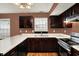 Traditional kitchen features wood cabinets, white countertops, and stainless steel appliances at 539 Deer Trail Dr, Indianapolis, IN 46217