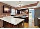 Well-lit kitchen with updated countertops, stainless steel appliances, and wooden cabinets at 539 Deer Trail Dr, Indianapolis, IN 46217